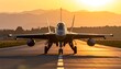© Buabeh - Front view of military jet on runway at sunset