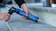 © shine.graphics - Applying sealant with a caulking gun for home improvement and construction