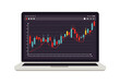 © denijulianto - Laptop displaying a candlestick chart with red and blue bars, indicating market trends and financial data analysis.