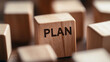 © photo for everything - Focus on Planning: A wooden block with the word 'PLAN' stands out among others, emphasizing the importance of planning and strategy in achieving goals and success.