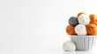 © Tee nuT - Soft yarn balls in various colors arranged in white basket create cozy and inviting atmosphere for crafting