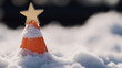 © photo for everything - Festive cheer spreads unexpectedly! An orange safety cone, topped with a golden star and dusted with snow, creates a whimsical holiday scene. A surprise winter decor.