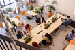 © PintoArt - Diverse business team collaborating in a modern open plan office