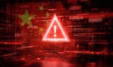 Cybersecurity alert concept with digital warning signs and Chinese flag overlay on red background symbolizing internet system threat or data attack risk.