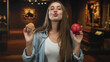 © Krakenimages.com - Woman holding red apple and muffin while puckering lips in gallery building; playful choice temptation.
