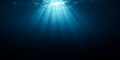 © DAKU MOHARAJ - Bright blue ocean sunlight bursts with rays through the dark underwater scene