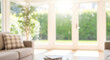 © RYN Studio - Bright Blurred Living Room Interior with Sunny Garden View