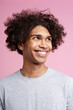 © Maria Vitkovska - Attractive African American man with piercing in nose looking away isolated on pink background