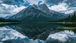 © AbstractAI - A captivating scene of majestic mountains mirrored in a calm lake, illustrating natural beauty, seasonal change