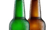 © PS Poppy - Chilled Refreshment: Two beer bottles, one green and one brown, gleam with condensation, promising a refreshing and crisp experience.