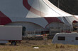 © Viktar - circus trailer setup, white trailer beneath circus canopy, trailer located under circus tent with visible wiring, white trailer placed beneath circus tent canopy with visible electrical cables
