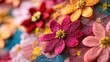 © hawarie - Close-up of vibrant, handcrafted fabric flowers in various colors and textures.