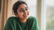 © Khawla - Smiling Indian Woman in Green Sweater by Window