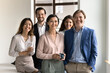 © fizkes - Team portrait smiling multiethnic department staff working together in office