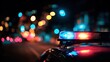 © Pavel - Flashing red and blue police car lights create a vibrant bokeh effect at night on a busy city street