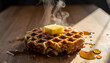 © Domurigu - Waffle with Butter and Syrup A Delicious Treat on a Wooden Table for Breakfast