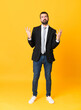 © luismolinero - Full-length shot of business man over isolated yellow background frustrated by a bad situation