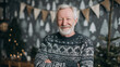 © Marvel’s Nook - Grandfather Christmas portrait of smiling elderly man in winter sweater standing in cozy decorated room with holiday atmosphere