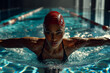 © Michał Magiera - Kobieta podczas intensywnego treningu na basenie — skupienie, technika i dynamiczny ruch w wodzie uchwycone w realistycznym, sportowym kadrze