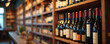 © miss irine - Rows of wine bottles on shelves in dimly lit store. Blurred background creates warm inviting ambiance perfect for beverage advertising or wine bar concepts. Diverse selection offers quality choices.