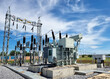 © Tinglee - 115kV Take-off tower and Transformer feeder in a switchyard of substation on clouds and blue sky background.