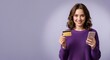 © Vasiliy - Smiling woman holding a credit card and smartphone for online shopping. Happy customer making a mobile payment. E-commerce and fintech concept with copy space