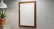 © Haley - Empty wooden-framed poster or notice board mounted on a plain wall in modern interior design aspect