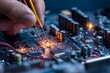 © kuchina - Close-up of a technician repairing a computer motherboard with soldering iron, showcasing the complexity of electronic repairs and the intricate details of the circuit.