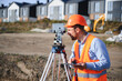 © Serhii - Surveyor checking site plan with theodolite