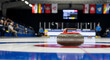© Jafree - Curling match showcasing close-up of curling stone on ice rink with international flags in background. concept of winter sports, precision, teamwork