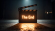 © Taiwo - Clapperboard with the illuminated text 'The End' to signify the conclusion of a film, television show, or video production.