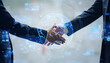 © metamorworks - Group of business people shaking hands and global business concept