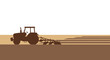 © Jonmart - Silhouette of a tractor plowing a field during a sunny day illustrating agricultural work and cultivation