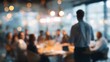 © hao - Business Presentation Blurred Background Businessman Giving Speech During Seminar With Coworkers In Office Standing At Desk In Boardroom Diverse People Sitting At Table And Listening T : Generative AI
