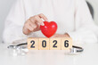 © Jo Panuwat D - Happy New Year 2026 with Stethoscope of doctor and heart shape on table. health care, Insurance, Wellness and medical concepts
