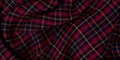 © Chandan - Red, Blue, and Orange Plaid Tartan Fabric Material. Classic Seamless Flannel Cloth. Traditional Wave Pattern for a Plaid Background or Wallpaper. Red, Blue, and Orange Checkered.