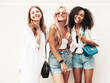 © halayalex - Three young beautiful smiling female in trendy summer clothes.Sexy carefree multiracial women posing on the street background.Positive models having fun in sunglasses. Cheerful and happy