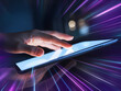 © Tithi - Hand touching a glowing tablet with futuristic light streaks