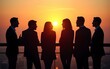 © Luke - A group of diverse business people engages in brainstorming on a high rise balcony at sunset, fostering creativity and collaboration. The silhouette adds an inspiring and contemplative ambiance.