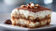 © Marta P. (Milacroft) - Tiramisu dessert slice with cocoa and chopped nuts