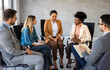 © NDABCREATIVITY - Business team having a meeting in office and solving problem. Teamwork, people and crisis concept.