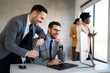 © NDABCREATIVITY - Portrait of successful business people working, talking together in corporate office during work.