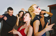 © Westend61 - Group of friends dancing and enjoying a party at home