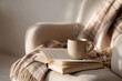 © Ирина Рычко - cozy reading corner with soft plaid, open book and mug