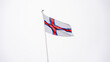 © ADDICTIVE STOCK - Faroe Islands flag waving proudly in the sky