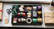 © Andrey - Christmas gift wrapping station, overhead view, festive colors, tools