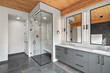 © Scott Prokop - Bathroom with a glass shower stall and a large mirror
