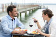 © auremar - couple having romantic dinner in sea restaurant