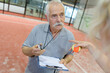 © auremar - close up shot of a man teaching tennis