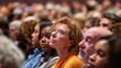 © CYBERPINK - Group of people sitting in a large auditorium, attentively listening to a speaker. the focus of the image is on a woman in the center, who is wearing glasses and an orange top.